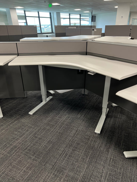 Humanscale float desk with boomerang shaped surface