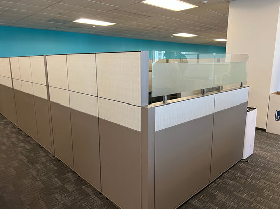 Haworth Compose workstation with glass and tall cubicle panels