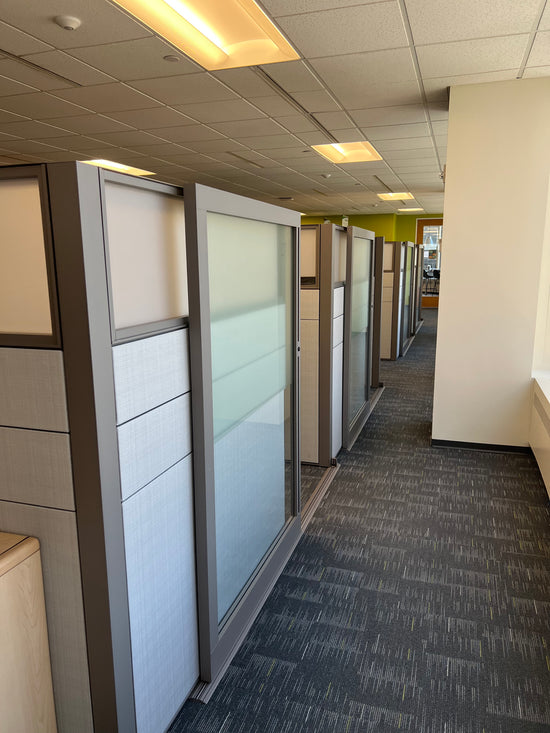 Haworth Compose private office workstations with glass and sliding doors