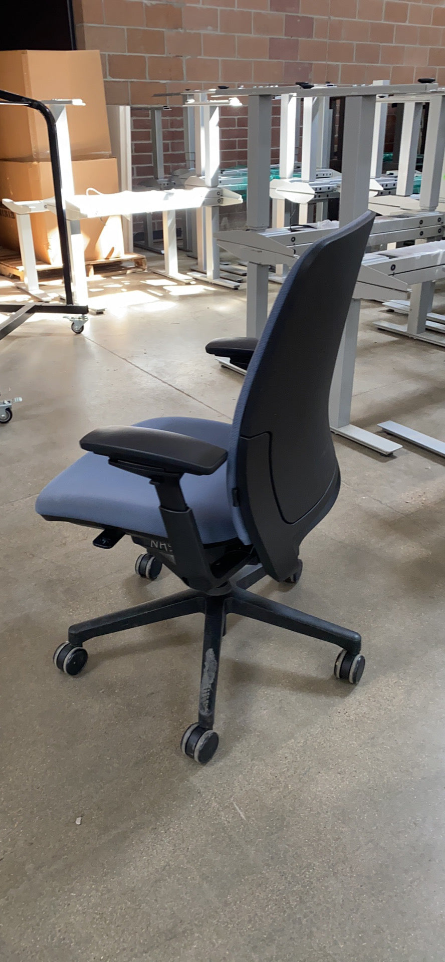 side view of Steelcase Amia chair in light blue
