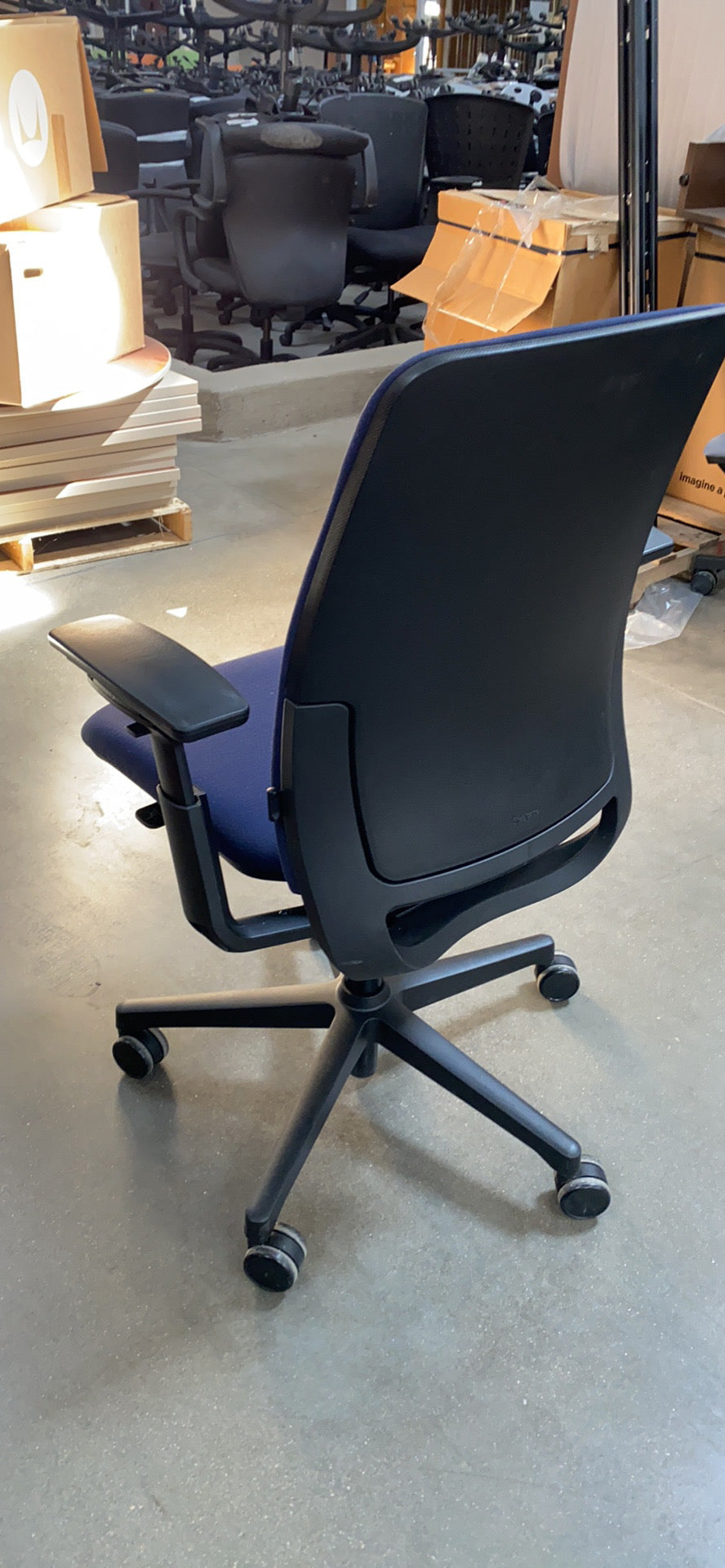 Load image into Gallery viewer, Side view of Steelcase Amia chair in light blue

